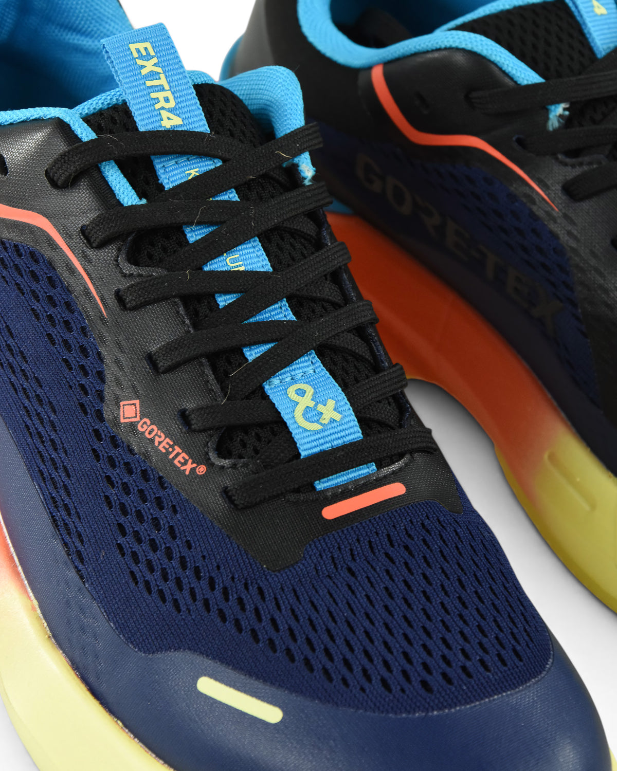 Waterproof running shoe lace and side view: black laces, blue accents, orange swoosh on navy.