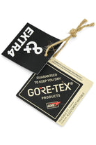 GORE-TEX guaranteed dry product tags on a string