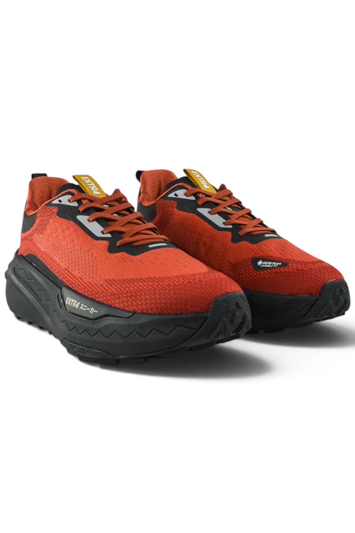 Rust orange waterproof running shoes with black soles, lace-up and side logos
