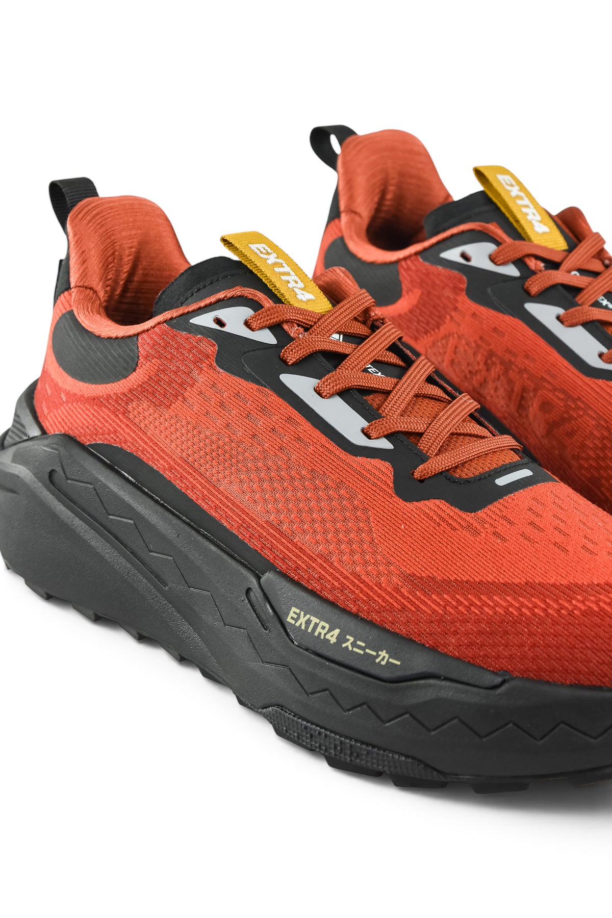 Rust orange waterproof running shoes with black overlays, lace-up, and EXTRA branding