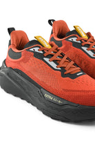 Rust orange waterproof running shoes with black overlays, lace-up, and EXTRA branding