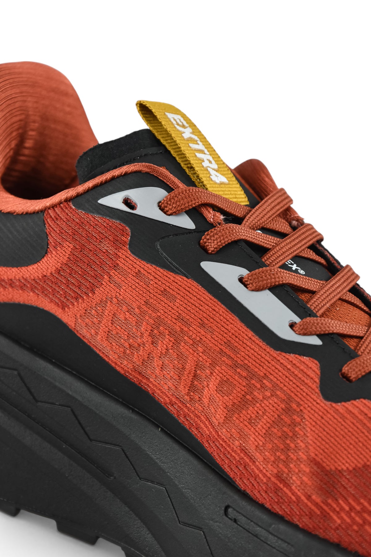 Rust orange and black waterproof runner shoes with orange laces and black rubber sole
