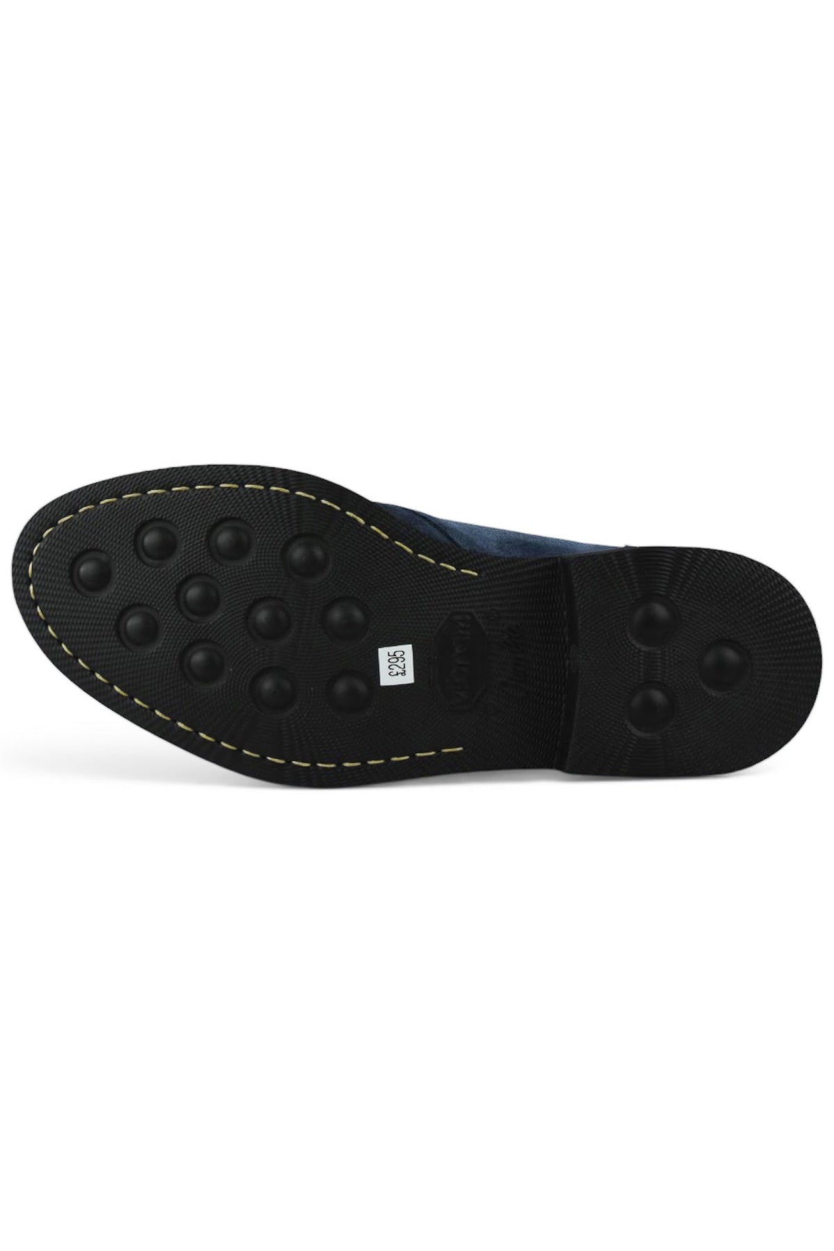 Navy chukka boot outsole with textured rubber tread and yellow stitch edge
