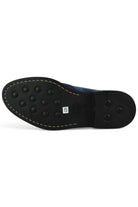 Navy chukka boot outsole with textured rubber tread and yellow stitch edge