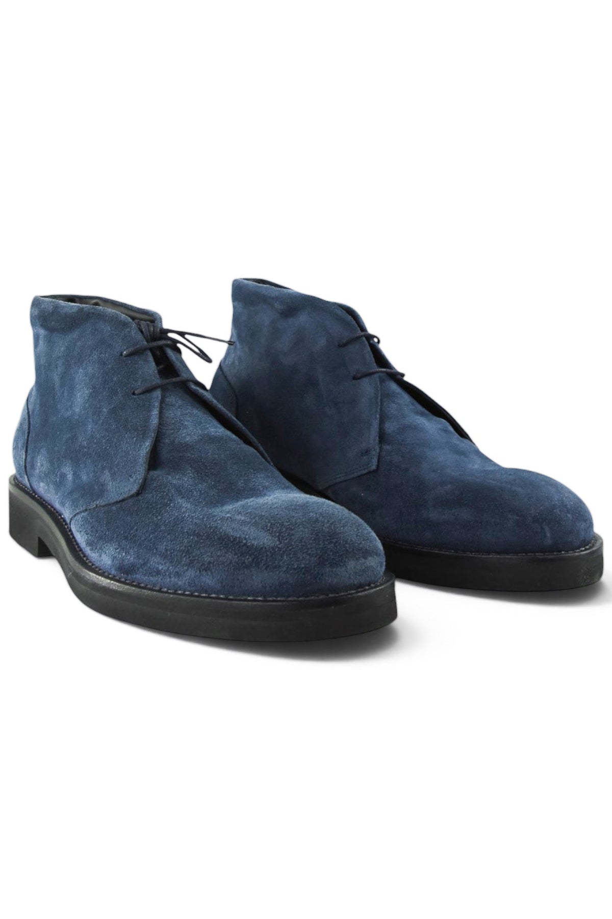 Pair of navy suede chukka boots with lace-up design and dark rubber soles