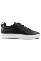 Navy leather low-top sneaker with lace-up front and white rubber sole.