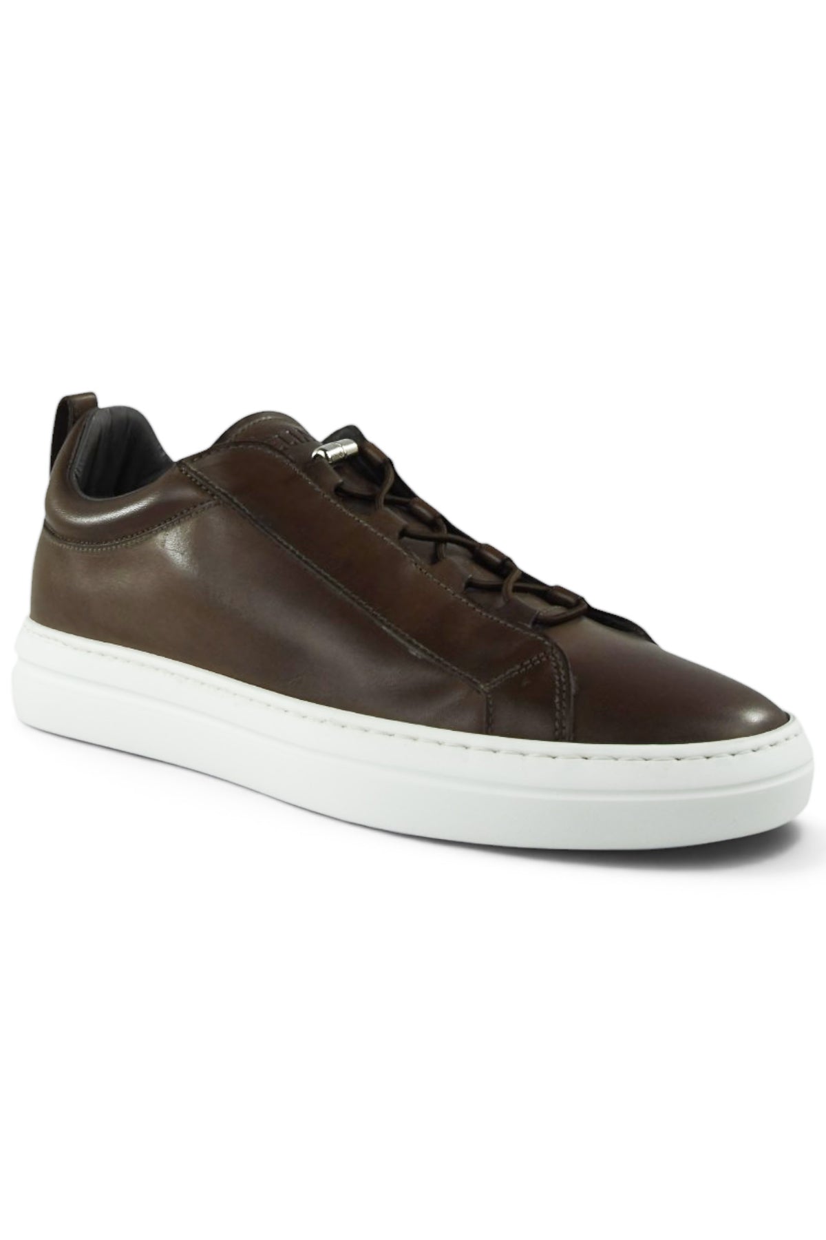 Brown leather low-top trainer with lace-up and white sole, side profile view