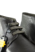 Dark leather ankle boot with lace-up front and metal eyelets