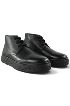 Pair of black leather lace-up ankle boots with rugged, textured rubber sole.