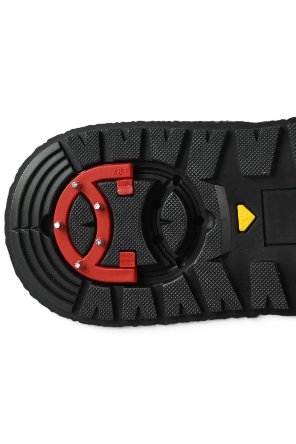 Black outsole tread with red circular grip plate and yellow arrow detail