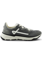 Grey trainers side view with white trim, lace-up front, and grippy black sole