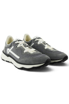 Grey knitted and suede trainers with white laces, side logo, and black rubber sole