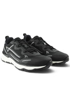 Pair of black lace-up tech trainers with mesh uppers, white midsole, and thick sole