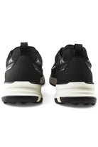 Back view of black lace-up trainers with heel pull tabs and cushioned white midsole