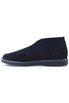 Blue suede chukka desert boots, front side view, lace-up design and rubber sole.
