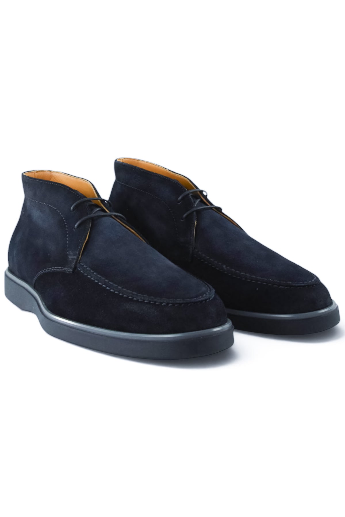 Pair of blue suede chukka desert boots with lace-up closure and rubber soles.