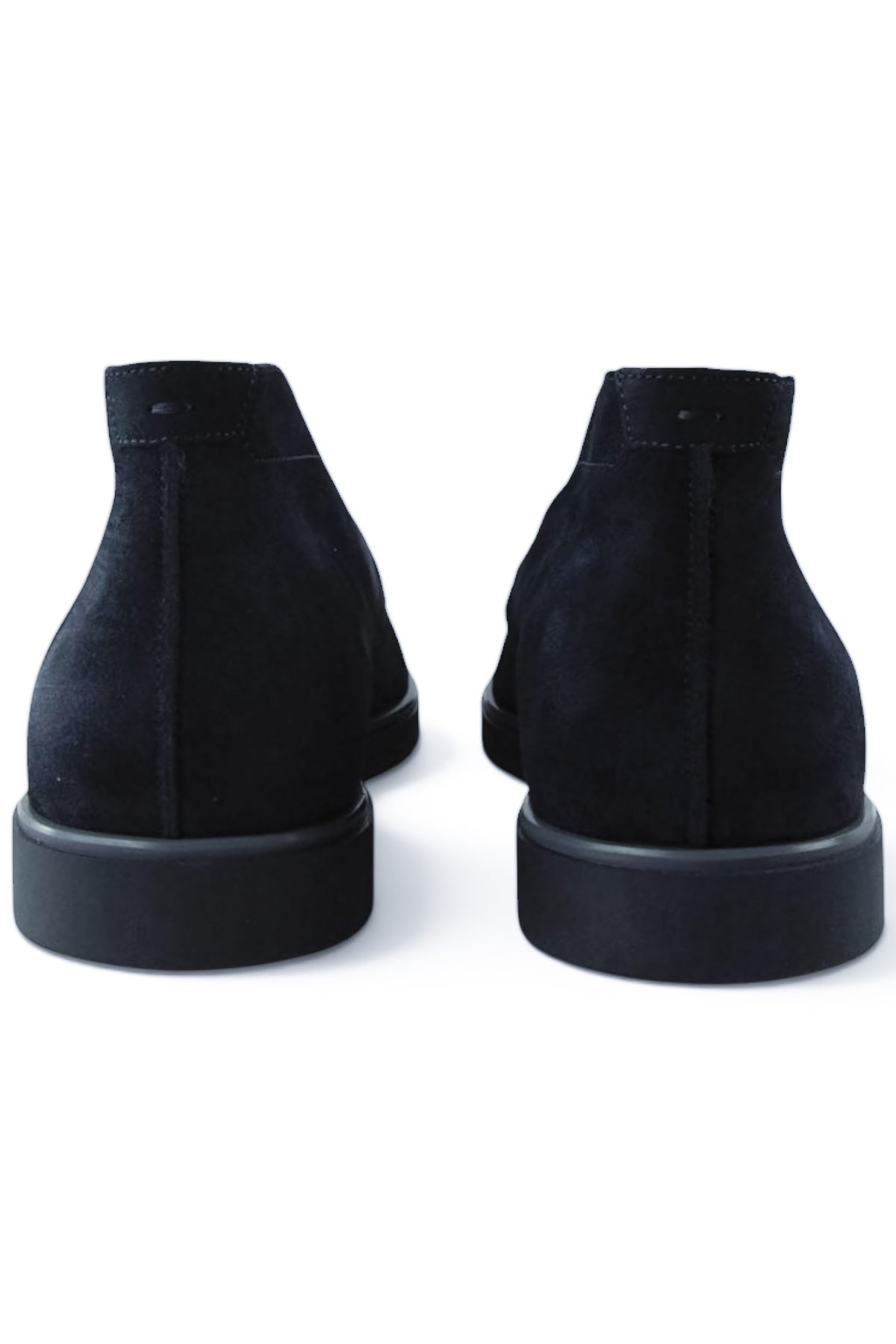 Back view of blue suede chukka desert boots with low-profile rubber sole.