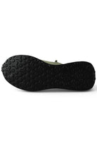 Khaki sneakers outsole view with textured tread and white midsole edge