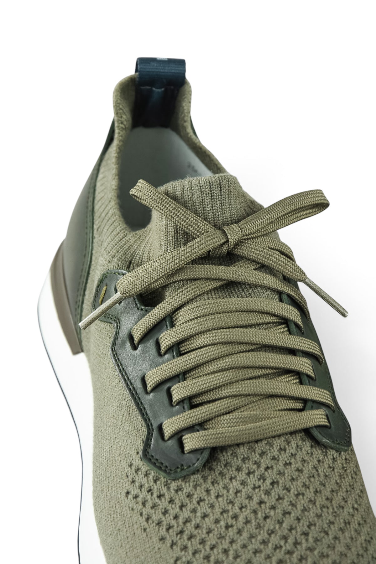 Khaki knit upper lace-up sneakers with green laces and leather heel overlay