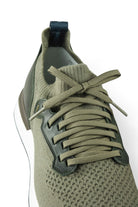 Khaki knit upper lace-up sneakers with green laces and leather heel overlay