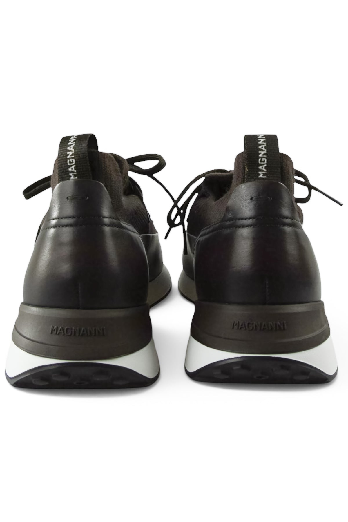 Back view of dark brown lace-up trainers with branded heel tabs and white soles.