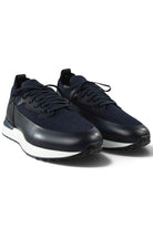 Pair of dark blue knitted and leather trainers with lace-up design and white rubber sole