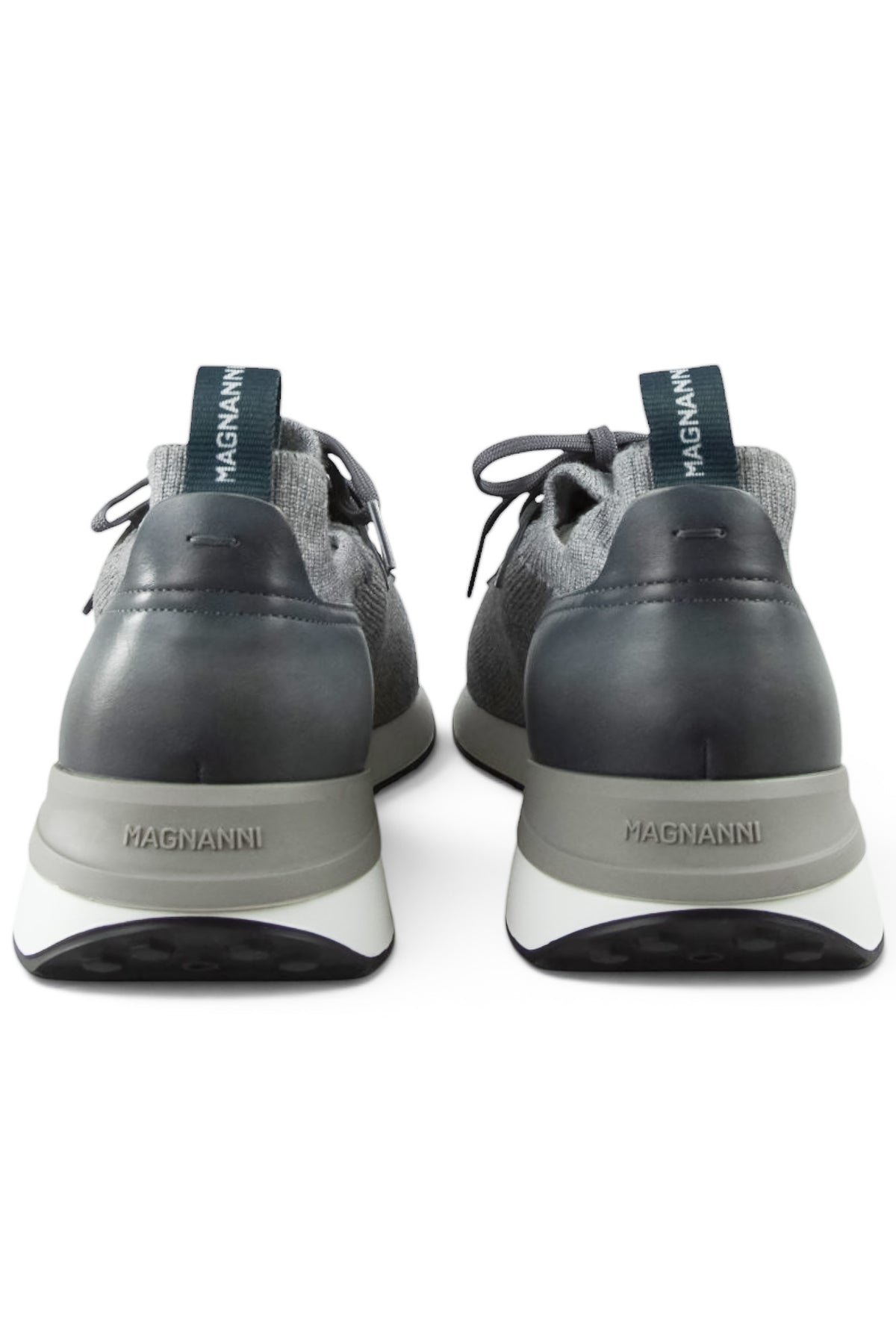 Back view of grey trainers with leather heel, pull tab, and cushioned sole