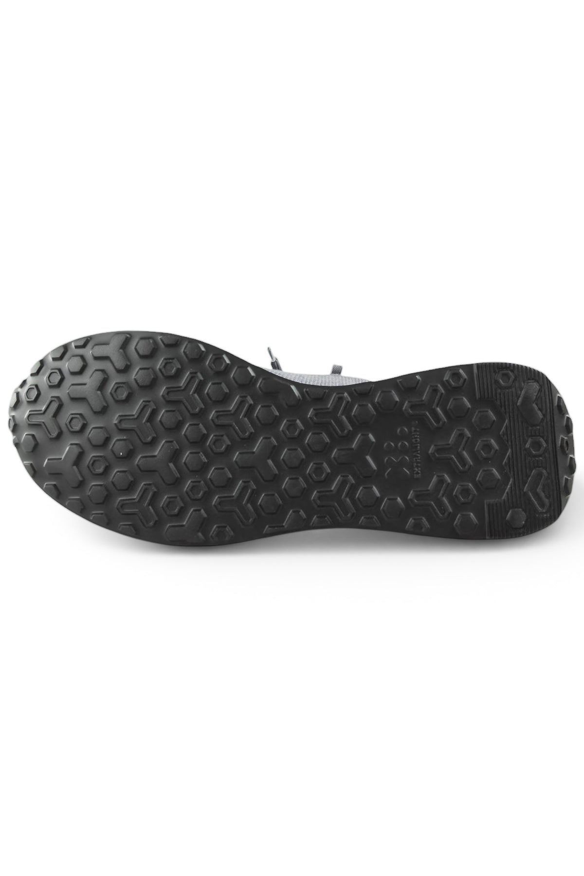 Trainer outsole with hex-pattern tread, dark rubber sole view