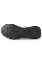 Trainer outsole with hex-pattern tread, dark rubber sole view