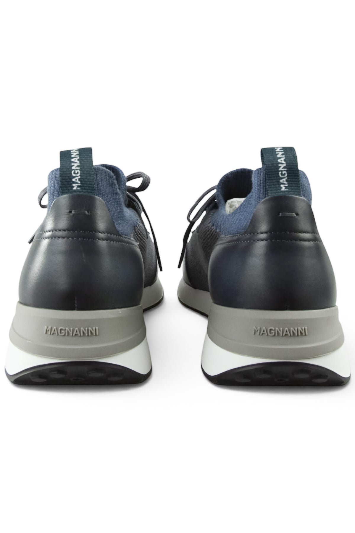 Men's trainers heel view with branded back tabs, dark leather heels and grey knit collars