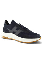 Navy knit trainer sneaker with lace-up front, gray accents, and white midsole