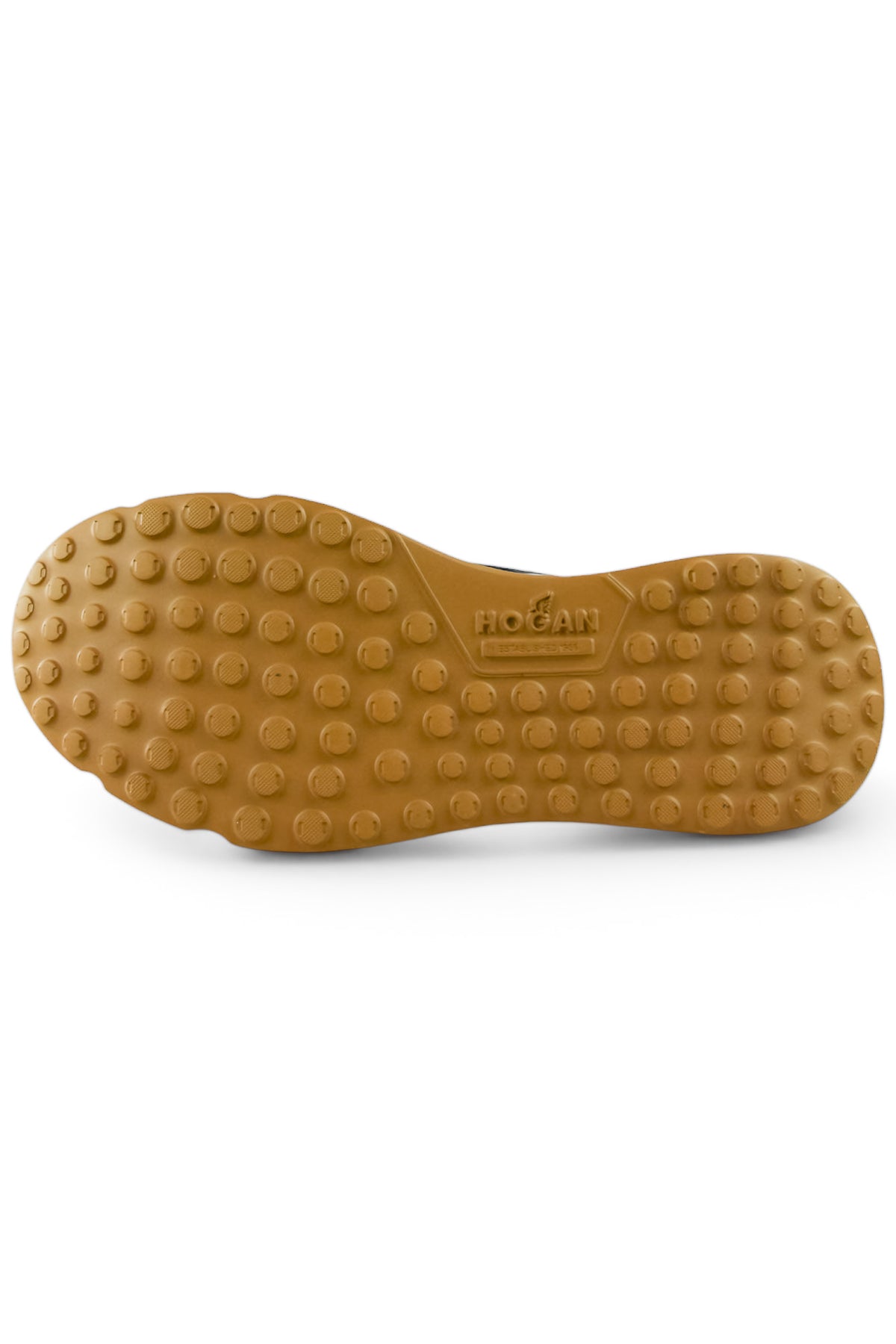 Gum rubber outsole for navy knitted trainer sneaker with textured grip studs