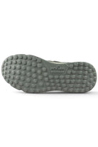 Grey rubber outsole with round traction nubs and Hogan logo on heel