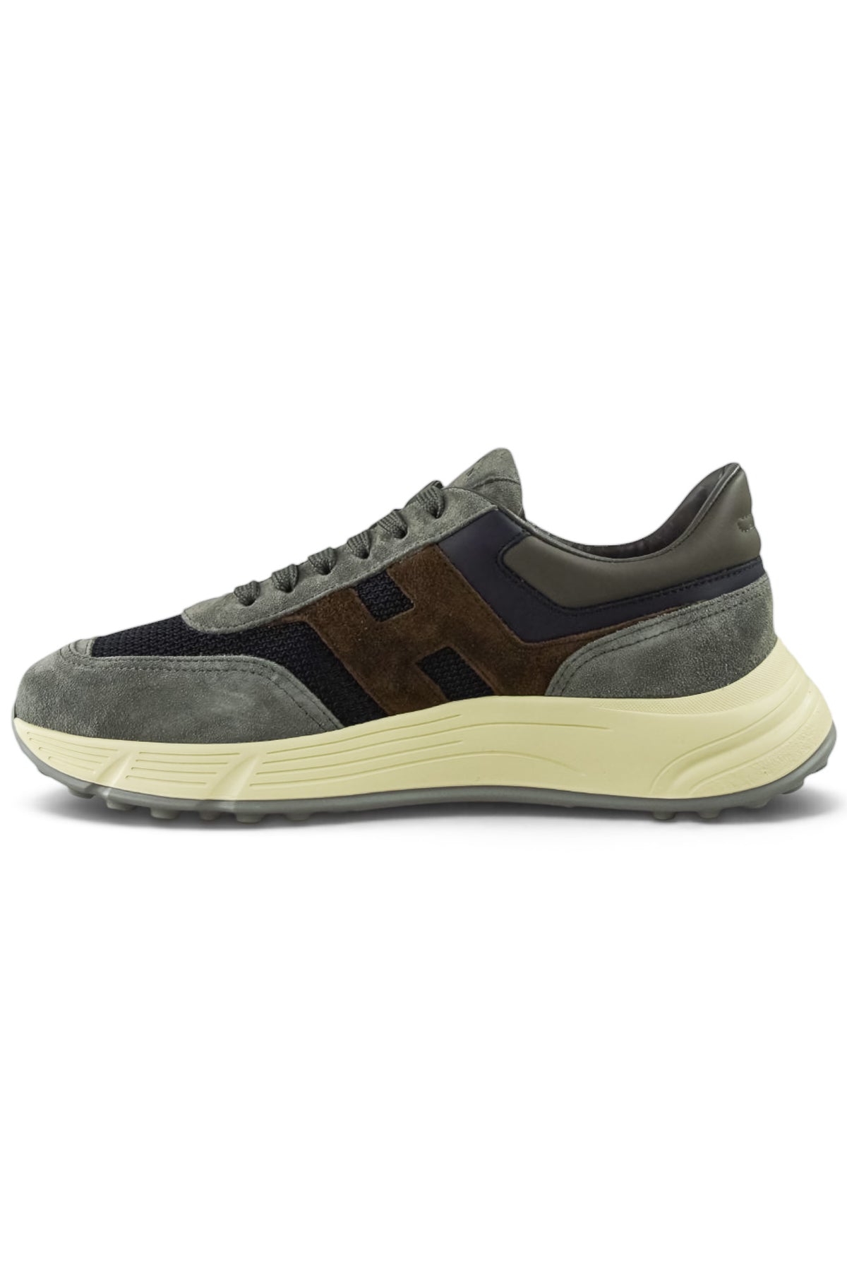 Hogan runner trainer profile view with grey suede upper and blue-brown side panels
