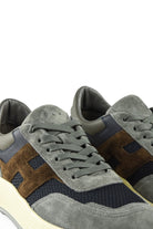 Hogan runner trainer close-up with grey laces and blue and brown side panels