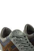 Hogan runner trainer close-up of lace area with grey suede and blue overlay