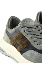 Hogan runner trainer side close-up with brown suede, blue squares, cream sole edge