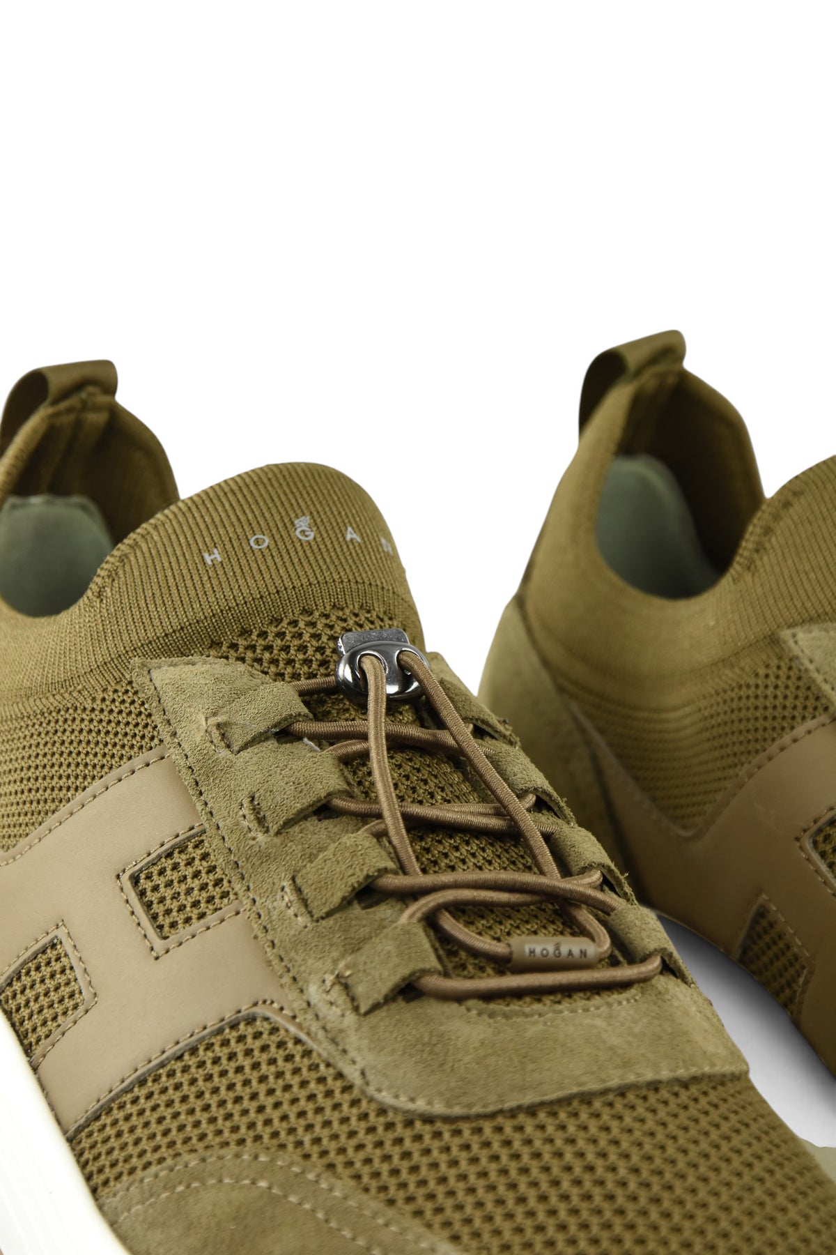 Khaki lace-up trainer with metal eyelets and perforated knit texture