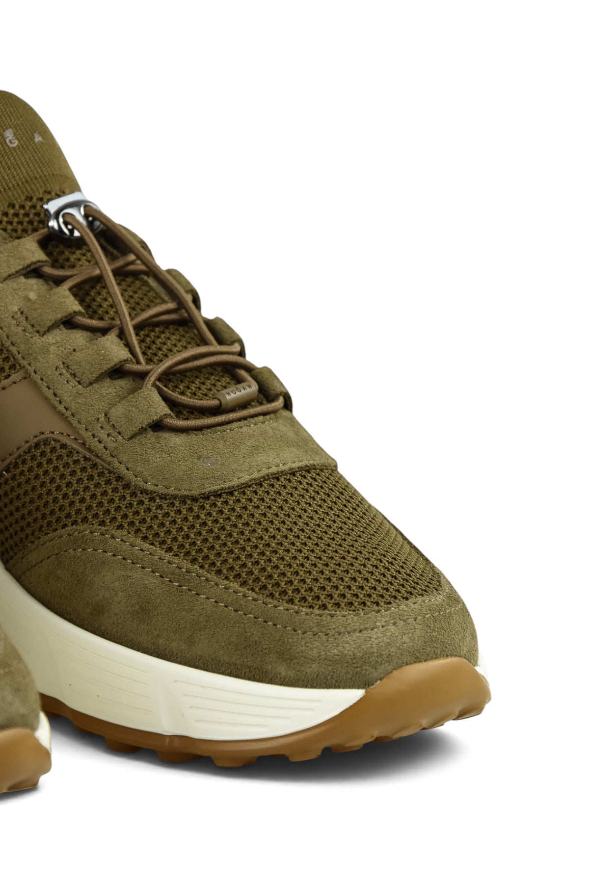 Khaki lace-up trainer with perforated toe box and white rubber sole