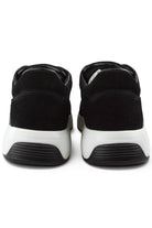 Black suede sneaker heels with white midsole and cushioned back