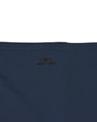 Navy neck gaiter close-up of center logo on fabric