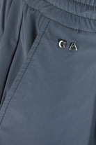 Steel grey stretch pants with GA logo near pocket seam