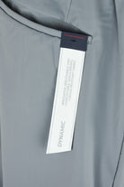 Seafoam grey technical stretch pants with brand label at inner waistband