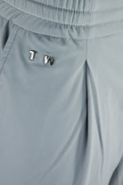 Seafoam grey technical stretch pants with elastic waistband and small logo on front
