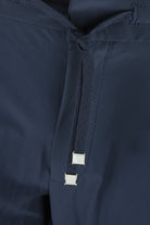 Dark navy pants with drawstring and two metal aglets at waistband.
