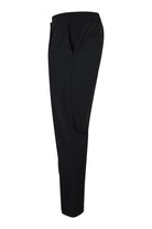 Black technical stretch pants with elastic waistband and tapered leg