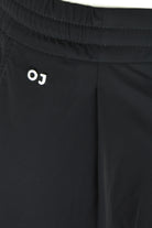 Black elastic waistband technical stretch pants with OJ logo