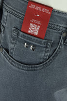 Grey denim jeans with coin pocket and red QR hangtag on waistband