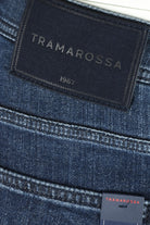 Dark blue fleece denim jeans with Tramarossa logo patch on waistband.