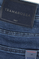 Tramarossa 1967 leather-look patch on dark blue denim waistband with stitching